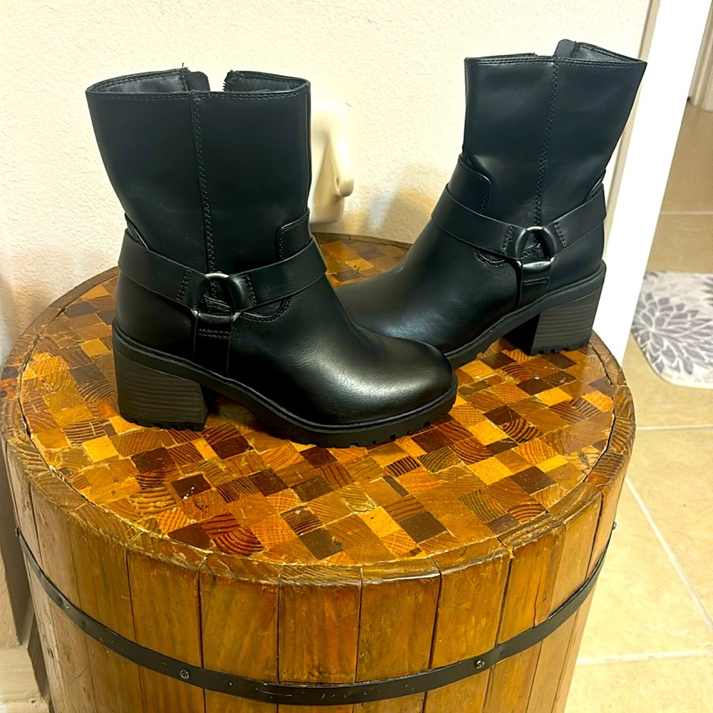 NWT black heeled boot. Never worn.